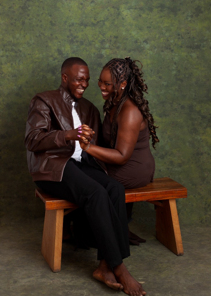 Wisdom and Similoluwa seated on a bench